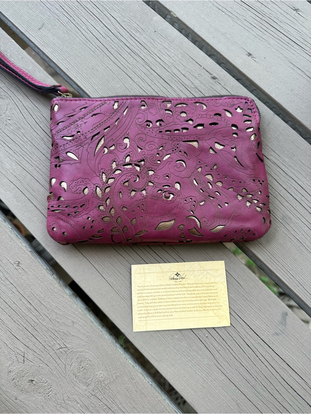 Patricia Nash Cassini leather perforated wristlet clutch rose and gold colored